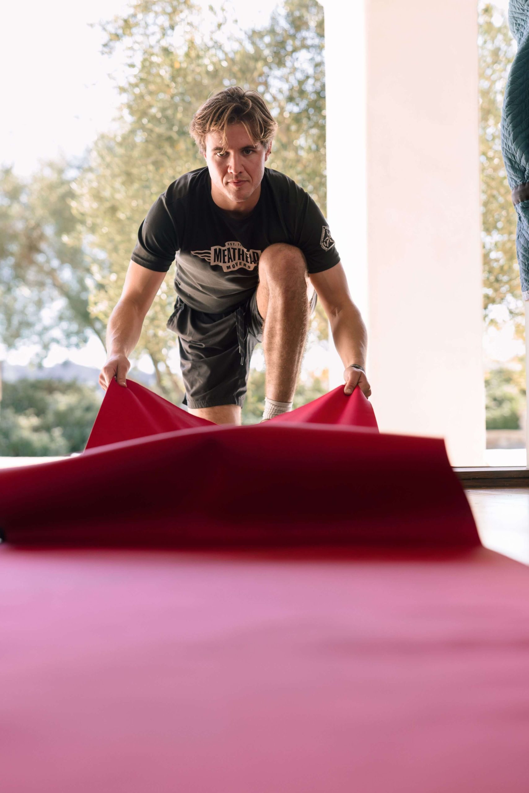 Meathead mover laying down a protective floor runner