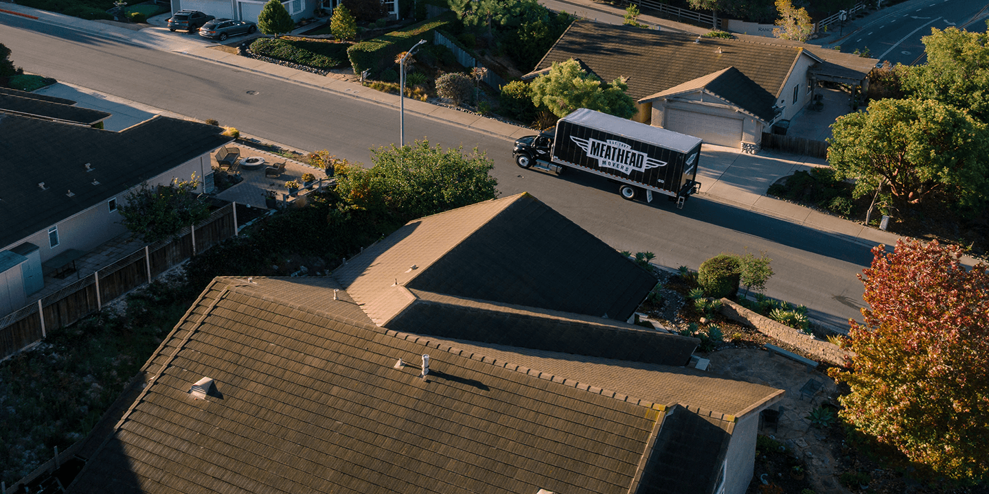 Aerial view of a Meathead Movers truck in a residential neighborhood
